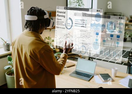 Black Man Testing VR App In Modern Office Stock Photo