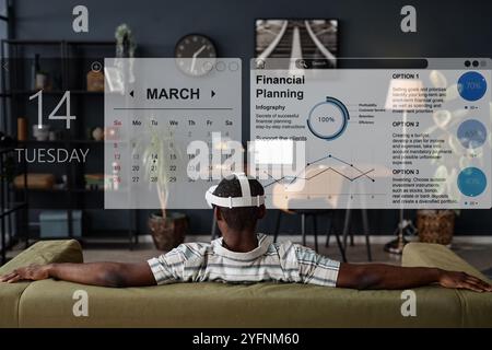 Man In VR Headset Using Planning App Stock Photo