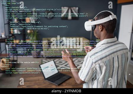 Black Man Using VR Headset For Work Stock Photo