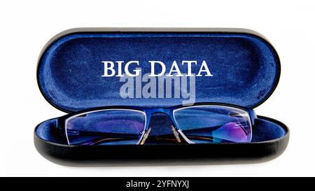 The concept of technology and development. Phrase, words, text BIG DATA written on the open case of the glasses case. Stock Photo