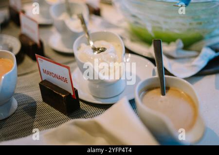 A close-up of creamy mayonnaise in a small bowl, showcasing its smooth texture and rich color, ideal for food or culinary themes. Stock Photo