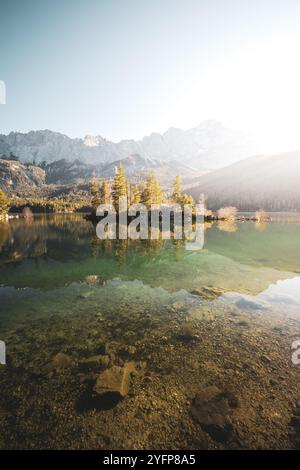 An den Ufern des Eibsees, der aufgrund seiner Lage unterhalb der Zugspitze und des klaren, grün getönten Wassers als einer der schönsten Seen der bayrischen Alpen gilt. Im Herbst zu Sonnenaufgang am 31.10.2024. // On the banks of the Eibsee, which is considered one of the most beautiful lakes in the Bavarian Alps due to its location below the Zugspitze and the clear, green-tinted water. In autumn at sunrise on October 31st, 2024. - 20241031 PD14460 Credit: APA-PictureDesk/Alamy Live News Stock Photo