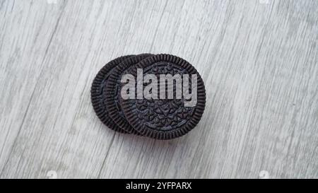 Chocolate cookies Isolated on wooden table Stock Photo