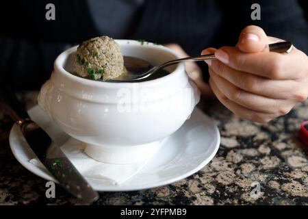 Beef soup with liver dumplings served on table.  Vienna. Austria. Stock Photo