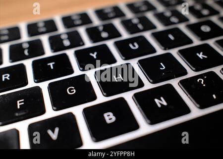 Closeup of laptop keyboard and letters. Stock Photo