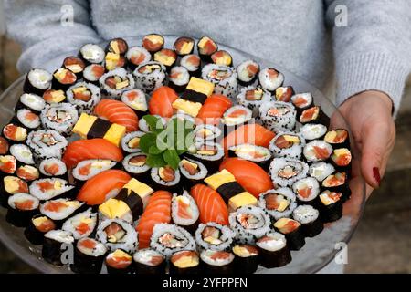 Different Japanese rolls and sushi on a plate. Japanese food. Stock Photo
