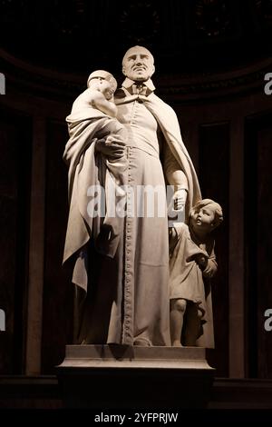 Sainte Marie-Madeleine, St Mary Magdalene catholic church, known as La Madeleine, Paris, France. Saint Vincent de Paul statue Stock Photo