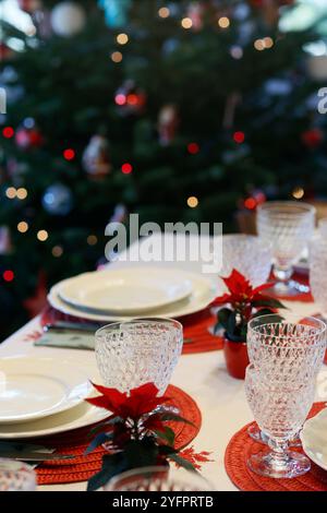 Table served for Christmas dinner in living room. Christmas celebration; Stock Photo