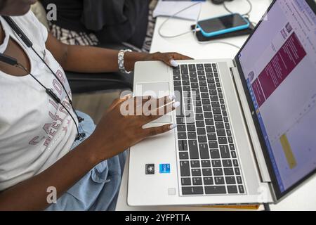 Office worker using computer, Accra, Ghana Stock Photo