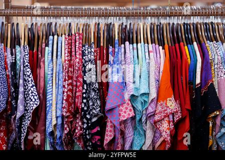 Batik Production. Batik is Indonesian traditional clothing.  Shirts on hangers in sale room.  Yogyakarta. Indonesia. Stock Photo