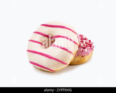 Two donut made of white chocolate and pink stripes with white background Stock Photo