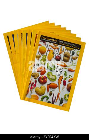 pile of National Geographic magazines isolated on white background Stock Photo