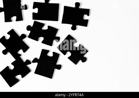 Unfinished connection: scattered puzzle pieces waiting to be put together Stock Photo