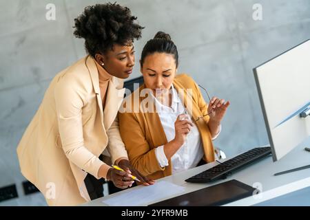 Team of programmers writing digital code in the metaverse and working together on the internet Stock Photo