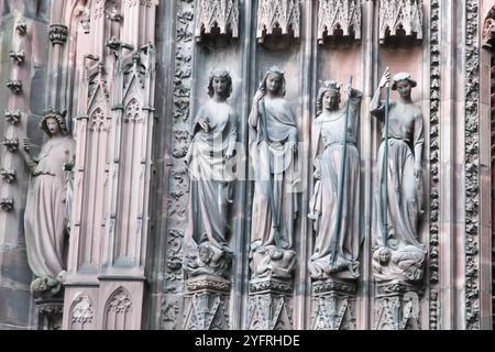 Statues, The Virtues Crushing the Vices, Strasbourg Cathedral, Notre-Dame Cathédrale de Strasbourg, Alsace, France, 2024 Stock Photo