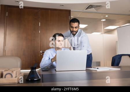 Diverse young male project managers working on marketing strategy Stock Photo