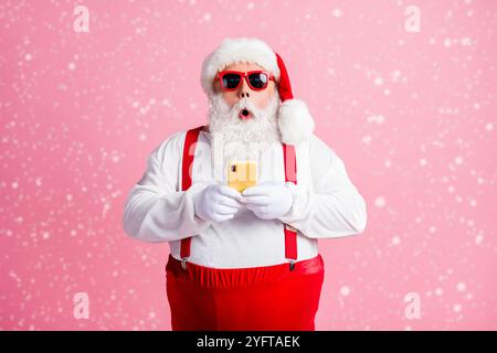 Portrait of his he nice attractive amazed bearded fat guy wear Santa costume using device blogging post social network media multimedia comment Stock Photo