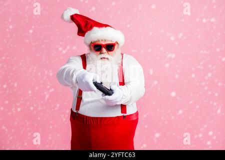 Portrait of his he nice funny focused bearded fat guy Santa father using gadget playing game station contest network battle competition air blow wind Stock Photo