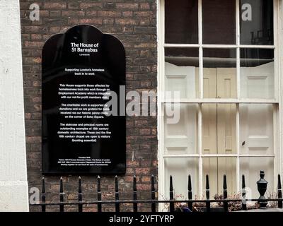 Information sign at House of St Barnabas, previously The House of Charity, 1 Greek St Soho. Founded in 1846, Permanently closed in Jan 2024. Stock Photo