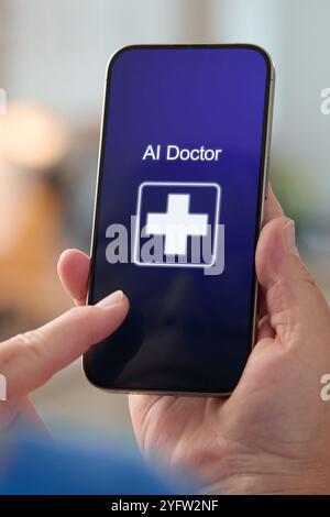 A user interacts with a smartphone displaying an application labeled AI Doctor, featuring a medical cross symbol. This technology represents advanceme Stock Photo