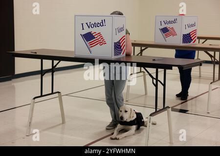 Bloomington, USA. 05th Nov, 2024. BLOOMINGTON, INDIANA - NOVEMBER 5: Voters cast their ballots in the gymnasium at St. John the Apostle Catholic Church on November 5, 2024 in Bloomington, Indiana. Americans vote today in the presidential race between Republican nominee former President Donald Trump and Democratic nominee Vice President Kamala Harris, as well as multiple state elections that will determine the balance of power in Congress. Credit: Jeremy Hogan/Alamy Live News Stock Photo
