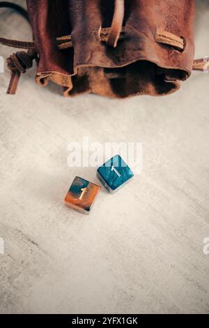 Still life of two six-sided dice with a dice bag Stock Photo