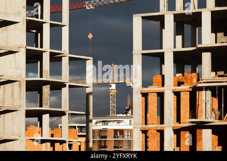 Uzhhorod, Ukraine. 4th Nov, 2024. High-rise buildings under construction, featuring unfinished concrete and brick structures. While intense fighting continues in eastern Ukraine, the western regions are experiencing a construction boom. Cities in western Ukraine, such as Lviv, Ivano-Frankivsk, and Uzhhorod, have become hubs of active building and infrastructure development. These areas are attracting both internally displaced people and new investors, driving demand for housing, commercial real estate, and public facilities. The economic growth in the western regions contrasts sharply with Stock Photo