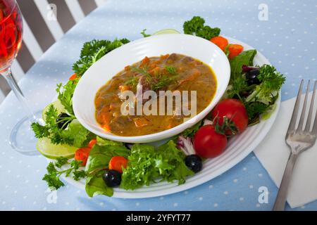 Delicious chicken hearts stew Stock Photo