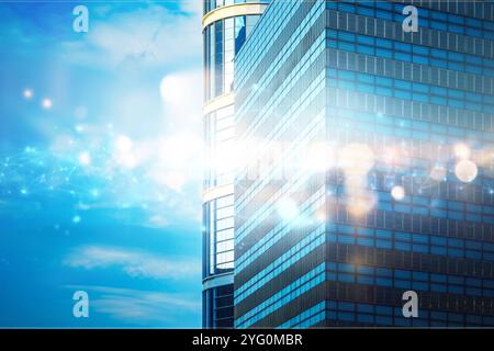 A modern skyscraper with a blue glass facade and a bright, glowing light emanating from its windows, set against a backdrop of a clear blue sky. Stock Photo