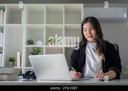 Overweight Office Assistant Engaging in Remote Collaboration for Diverse Teamwork Stock Photo