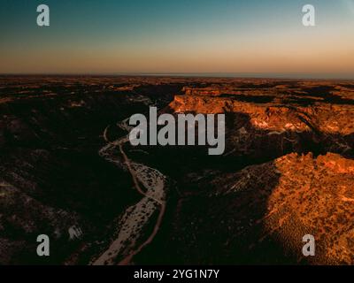 Windy dry riverbed in the valley of Cape Range National Park Canyon at sunset – golden hour. Stock Photo