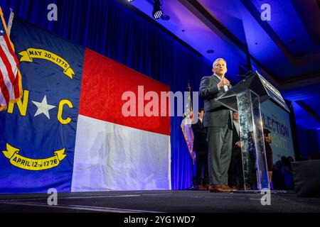 North Carolina Gov. Josh Stein, center, is greeted as he arrives to deliver the State of the
