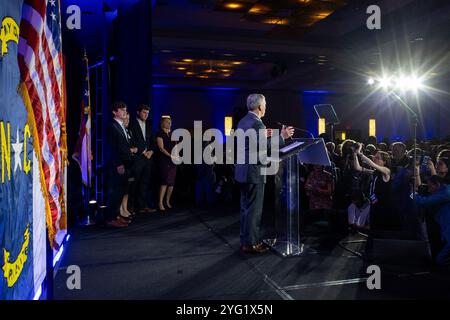 North Carolina Gov. Josh Stein, center, is greeted as he arrives to deliver the State of the