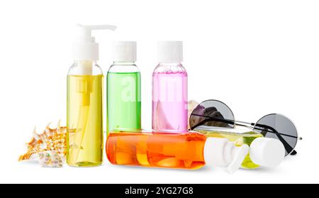 Assorted skincare products displayed on a white surface with a seashell Stock Photo