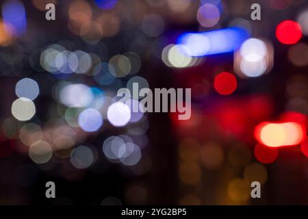 View of skyscrapers building and modern city skyline with colorful blur bokeh light background. Jakarta, Indonesia. Blurred cityscapes background Stock Photo