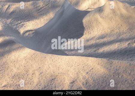 Shadow pattern on a snowdrift a cold winter day Stock Photo