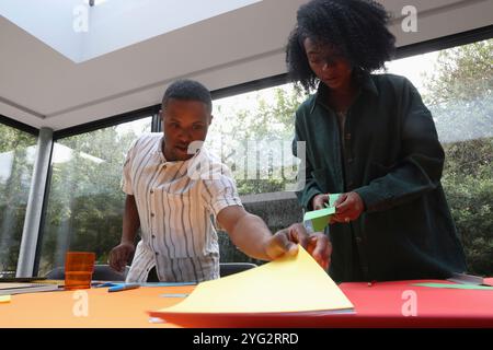 Man and woman doing arts and crafts Stock Photo