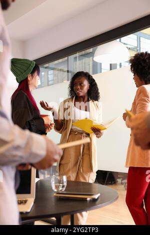 Diverse group of businesswomen standing in office Stock Photo