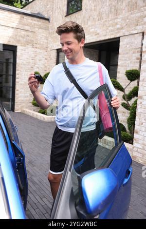 Man with type 1 diabetes monitoring blood sugar Stock Photo