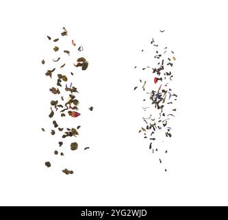 Falling dried tea leaves isolated on white background. Stock Photo