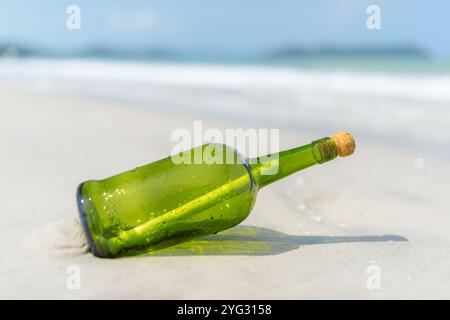 Message in a bottle (MIB) on a sand beach Stock Photo