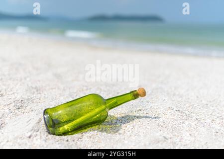 Message in a bottle (MIB) on a sand beach Stock Photo