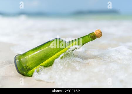 Message in a bottle (MIB) on a sand beach Stock Photo