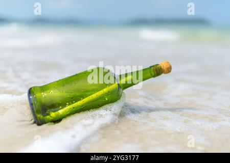 Message in a bottle (MIB) on a sand beach Stock Photo