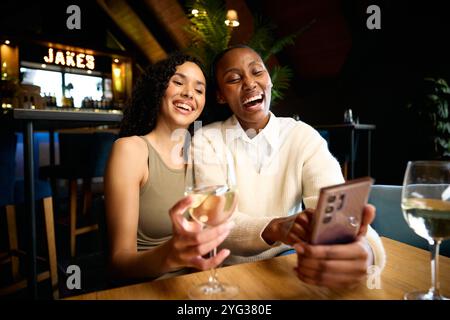 Two friends taking photos together  Stock Photo
