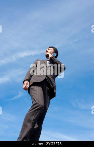 Businessman talking on mobile phone Stock Photo