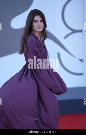 Guests attend the 'Kjaerlighet' red carpet during the 81st Venice International Film Festival at Palazzo del Cinema on September 06, 2024. Stock Photo