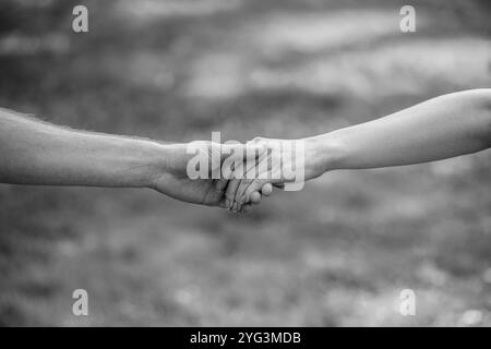 Hold hands male female Black and White Stock Photos & Images - Alamy