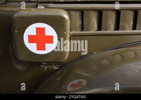 IVANO-FRANKIVSK, UKRAINE - NOVEMBER 3, 2024 - A first aid kit marked with a red cross is attached to the side of a car during the Style & Power exhibition in Rynok Square, Ivano-Frankivsk, western Ukraine. Twelve old cars and seven motorcycles were displayed in the city’s centre. The event was held to raise money for the Franko Hrazda, a rehabilitation centre for veterans. The display also aimed to collect money for the purchase of a car for the military on the front line. As reported, the exhibition generated UAH 17,681. Stock Photo
