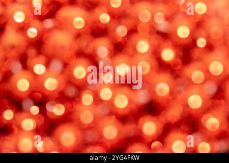 A warm and inviting background featuring soft orange bokeh lights, with glowing circular shapes that create a dreamy, out-of-focus effect. T Stock Photo